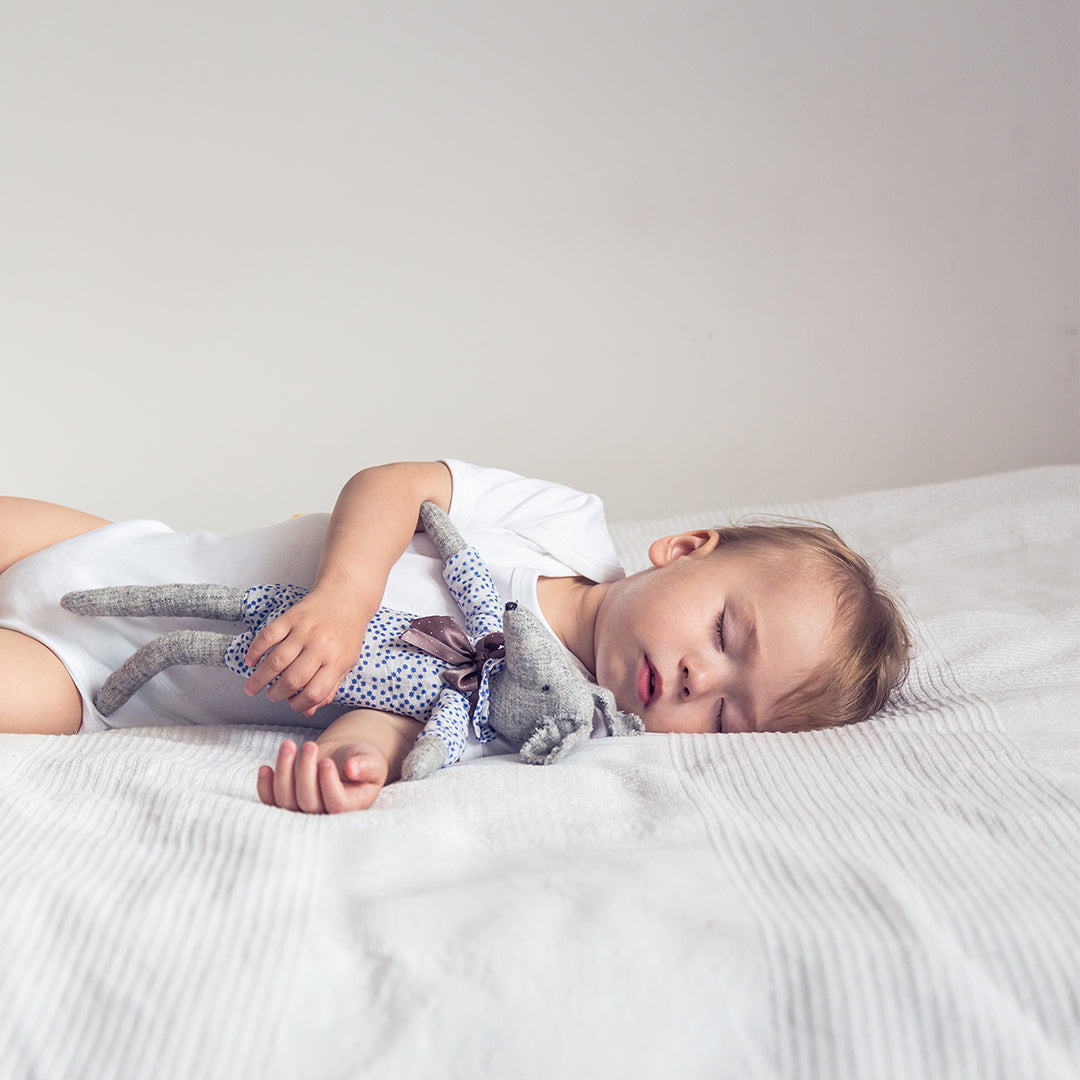 Cute Baby Sleeping with Long Legged Mouse